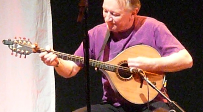 Dónal Lunny playing bouzouki on stage in Bristol, 2012