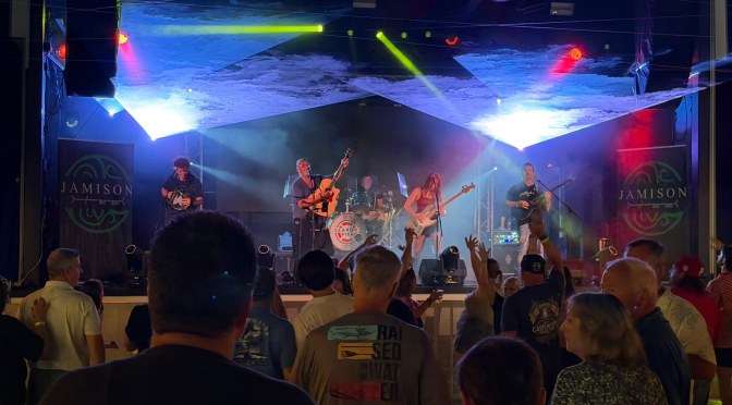 Philadelphia Celtic rock band Jamison on stage under coloured lights in front of a crowd